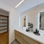 Master bathroom in Sunnyvale home remodel with dual sinks and marble finishes