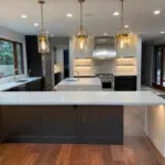 White marble countertop seating area with underlighting in Los Altos Hills kitchen remodel