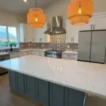 San Jose kitchen remodeling project featuring custom wood cabinets, granite countertops, and modern toe-kick LED lighting by a local general contractor.