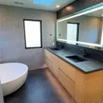 Modern bowl tub with floating dual sinks.