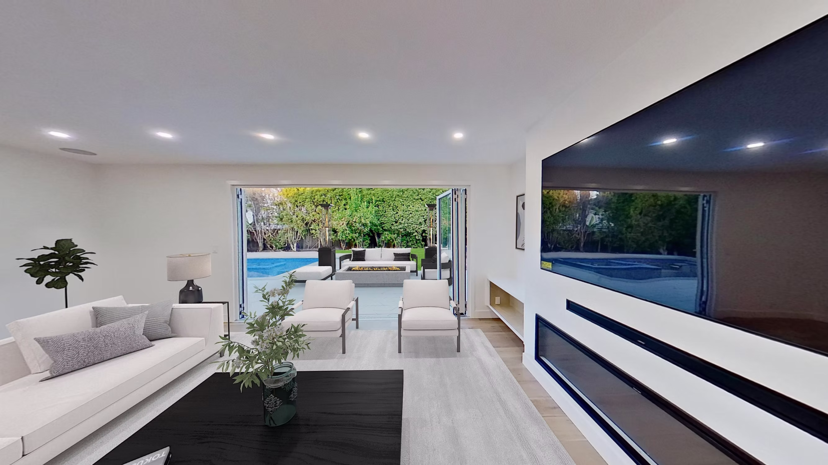 Sunnyvale home addition with open living room overlooking patio and pool – Sigura Construction